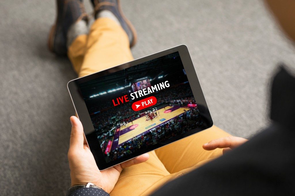 Man watching sports on live streaming