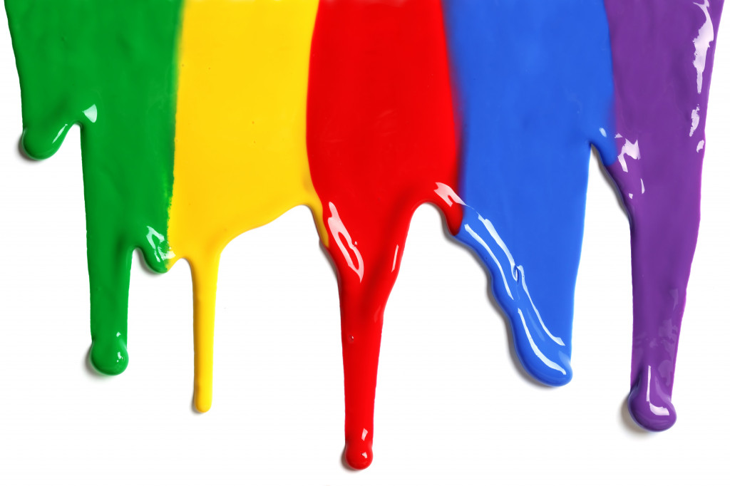 Paint dripping in different colors representing creativity